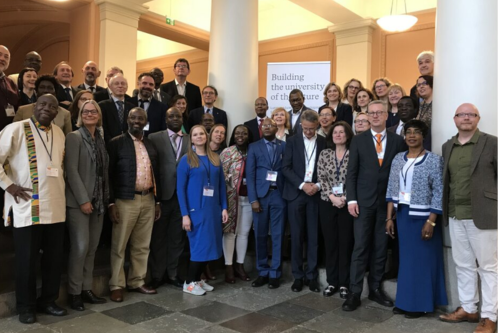 A group of African and European researchers at an event.
